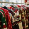 Shopping-early-for-a-Christmas-jumper-in-a-UK-charity-shop-in-August